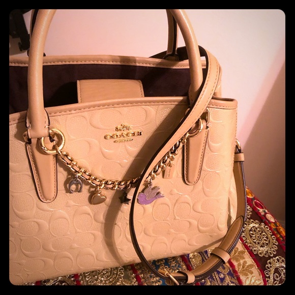 Coach Handbags - Gorgeous Coach leather shiny handbag with charms